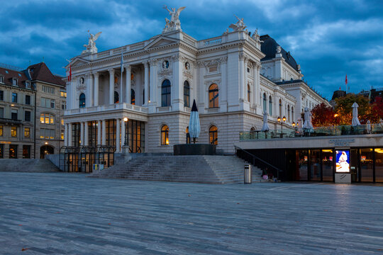 A beautiful view on the illuminated famous Zurich Opera House on an early evening with an impressive cloudscape. The theatre is located at the Sechsel&auml;uten square which is also used for many events du
