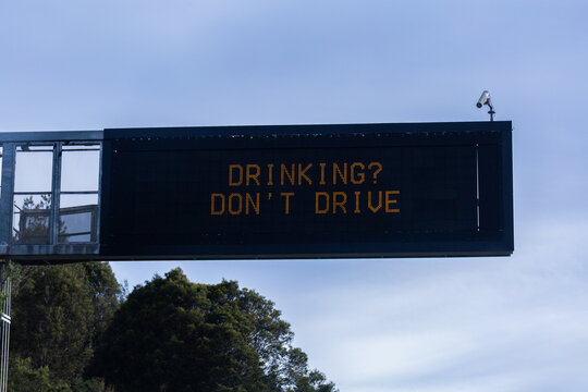 Drinking? Don&rsquo;t drive warning notice text on overhead digital sign above road in NSW Australia