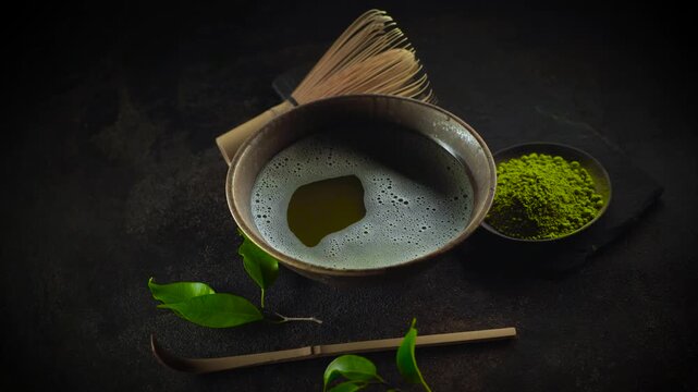 Matcha Tea Composition with tea powder, whisk amd bamboo spoon
