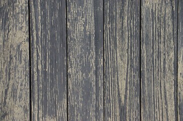 Fototapeta premium Background, texture of old boards faded in the sun and weathered with paint residue