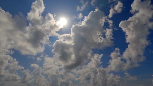 Timelapse of cumulus clouds moves in the blue sky.