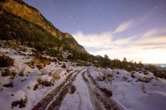 Snowy road with an an amazing stars at Fivefingers Mountains, Kyrenia, Cyprus.