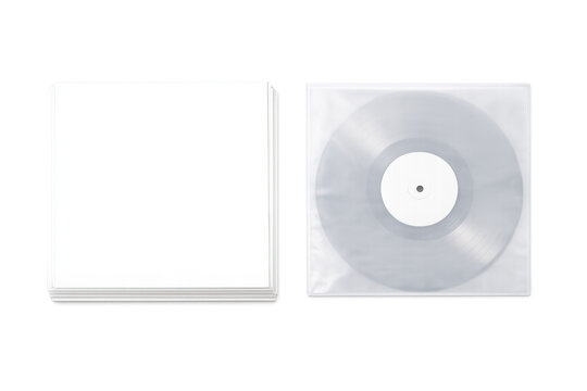 Stack of blank white record sleeves next to a clear vinyl record in a plastic sleeve