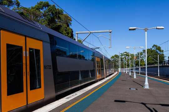 passenger train stopped at platform of Narwee station in Sydney suburb 