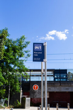 kiss and ride drop off sign nearby school and train station in city