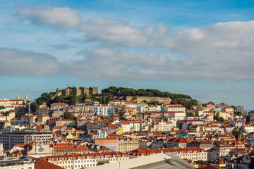 Fototapeta premium Elevated View of São Jorge Castle and the Historic Alfama District in Lisbon, Portugal