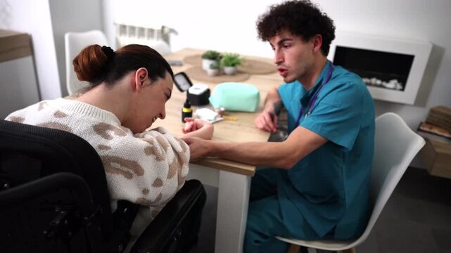 Young male caregiver helping a woman in a wheelchair with her diabetes management, using a glucometer to measure blood sugar levels during a routine home visit and providing medical support