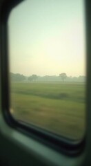 View of a field from a train window