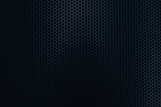 Black perforated metal grill texture background with gradient light,Macro,Close-up of a black metallic perforated mesh surface. The pattern features circular holes in a geometric honeycomb-like.