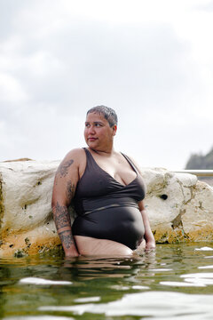 French Islander woman portrait in ocean tidal pool