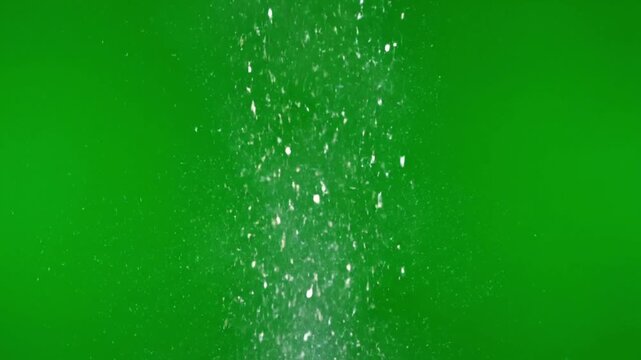 Falling White Particles in Motion on Bright Green Background