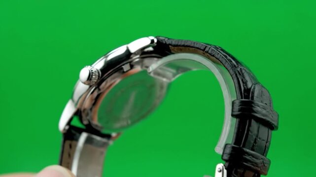 Close-Up of Wristwatch with Black Leather Strap