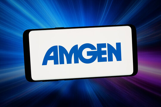 Stuttgart, Germany - 02-25-2026: In this photo illustration, the logo of US biopharmaceutical company Amgen Inc. is displayed on a smartphone in front of abstract background on computer screen.