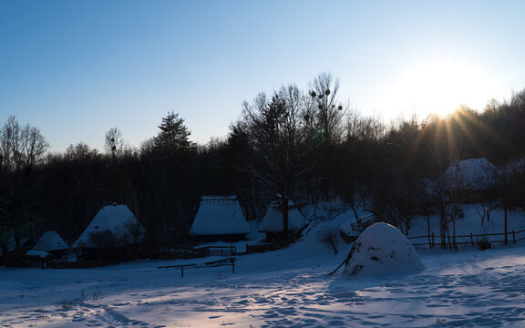 Ukrainian village on the dusk. Seasonal landscape. Winter
