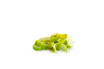Fresh lime zest isolated on white background. Lime zest or peel close-up. Grated citrus peel. Lime...