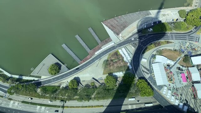 Downward View from Macau Tower Observation Deck Showing Tower Base and Shadow.
