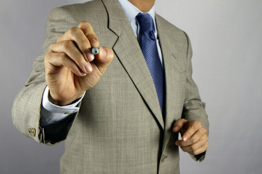 Businessman Writing with Marker on Transparent Screen Concept
