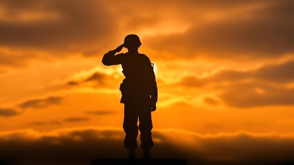 Obraz premium Military silhouette saluting against sunset sky