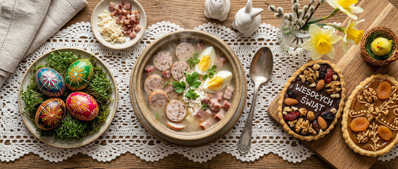 Naklejka premium Traditional Polish white borscht with horseradish, egg, sausage, and bacon. The plate sits on a lace table runner. Easter arrangement