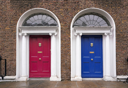 Well preserved twin doors of Georgian townhouses with fanlight windows above