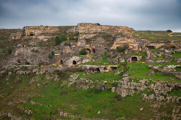 Fototapeta premium Ancient cave dwellings in Matera Italy historic Sassi landscape
