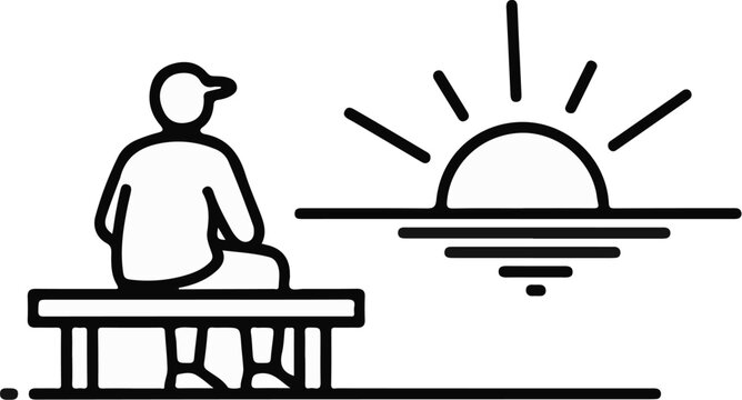 A person sits on a bench watching the sun rise over the water