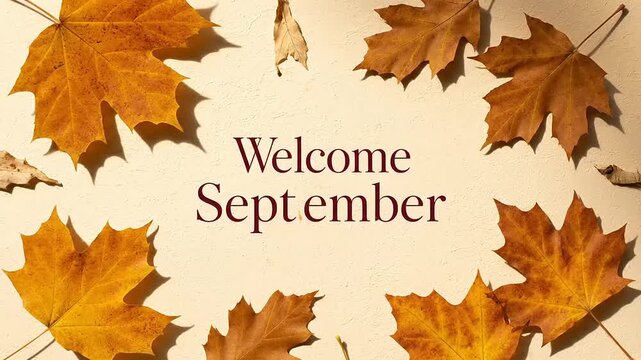 Welcoming September A vibrant autumn display of golden and orange leaves framing a serene message, signaling the cozy arrival of the fall season and its natural beauty