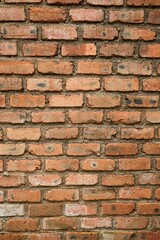 Fototapeta premium Old rustic red brick wall texture background with weathered bricks
