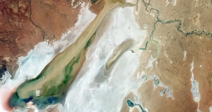 Aerial perspective on  salt marsh, white salt deposits. Camera is zooming out, rotating counterclockwise. Animation based on image by NASA