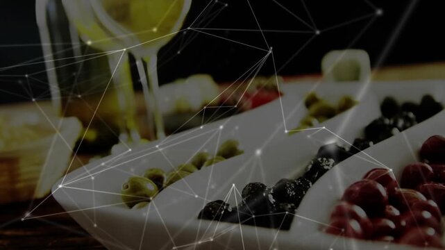 Camera pulling back, panning up; dish, wine glasses shifting as overlay drifts to show drinks