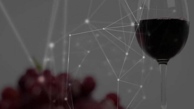 Red grape cluster shifting forward as nodal network sweeping right, showing glossy grapes