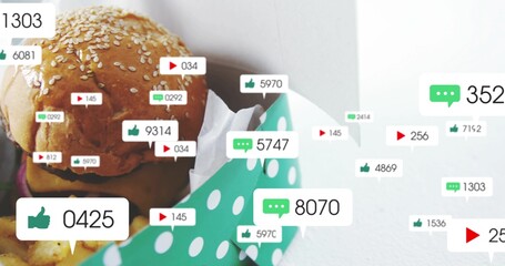 Showing sesame burger in green dotted takeout box on tabletop with white paper, fries, social icons © vectorfusionart