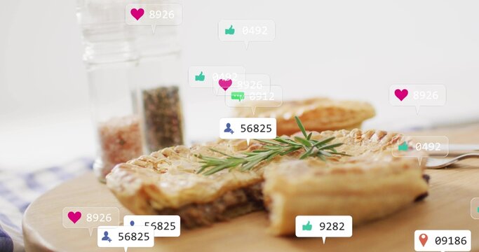 Showing hand pie sitting on wooden board on kitchen table, with rosemary, fork, shakers, overlays