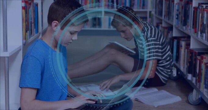 Boys typing devices in library, Cyber Security appearing between them, HUD expanding for learning