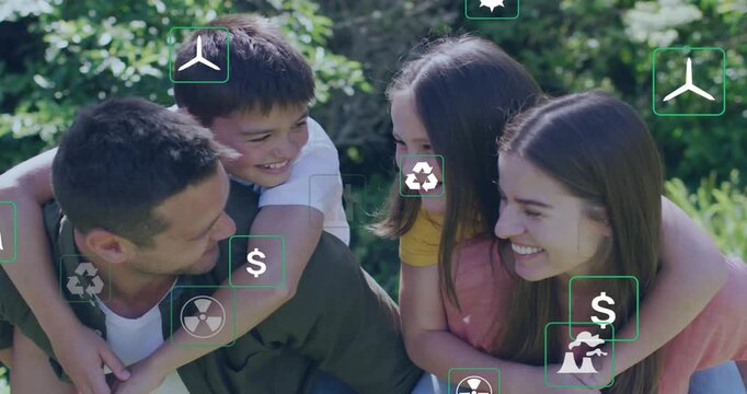 Family playing outdoors camera pan causing eco icons to cluster around them showing energy options