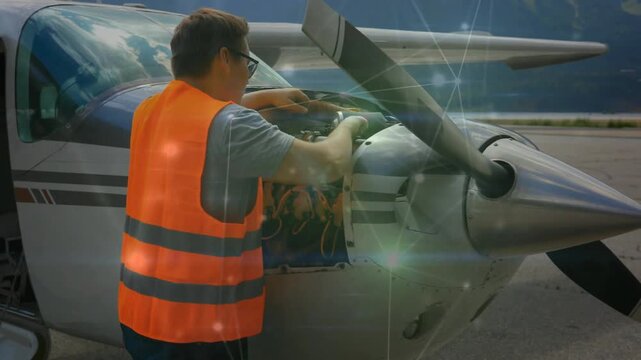 Tech opening cowling and inspecting plane for preflight check, animated labels tagging hoses wires