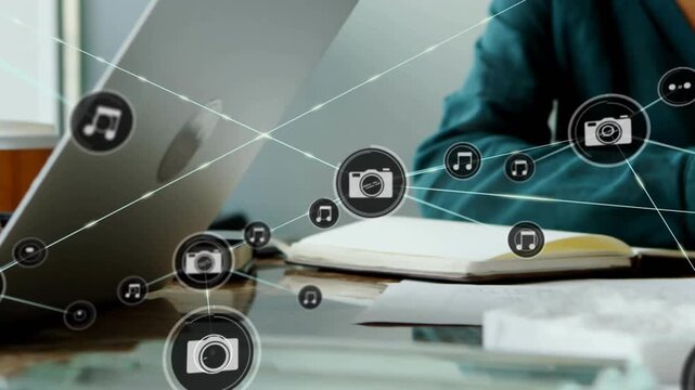 Tablet user tapping, initiating camera or music icons multiplying, laptop user typing, sharing media