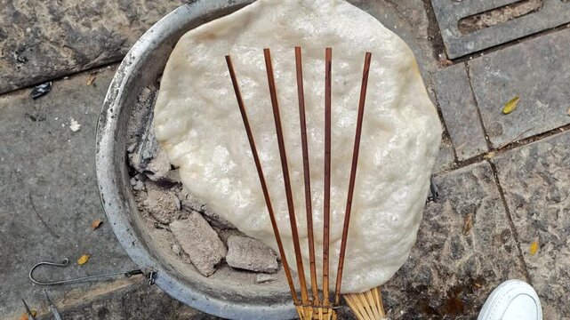 Yunnan,China,street food,sticky rice cake,roasted,charcoal,grill,fluffy,bamboo tool,traditional,folk,culture,Xishuangbanna,Puer,handmade,ingredients,cooking,preparation,authentic,local cuisine,snack,c
