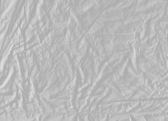 Obraz premium Wrinkled transparent plastic sheet texture isolated on transparent background. Detailed glossy fold overlay.