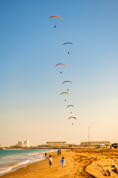 Para gliding at beach
