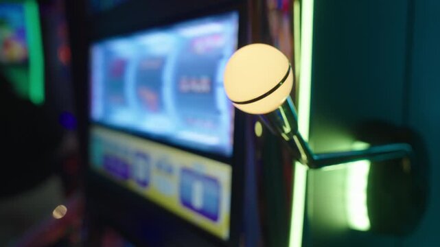 Hand of female gambler pulling slot machine lever under colorful neon lighting. Modern casino interior with dramatic reflections and bright atmosphere.