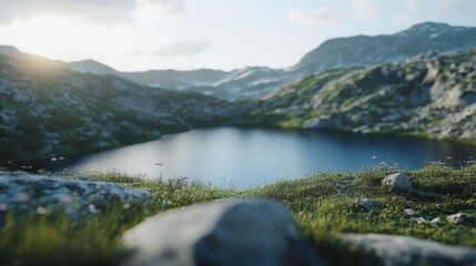 Obraz premium A tranquil mountain lake reflects the cloudy sky amidst a lush, green landscape, evoking profound peace and natural beauty.