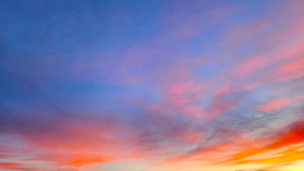 A soft, pastel dreamscape where candy-pink wisps melt into a tranquil periwinkle sky. This Mediterranean dusk feels gentle and weightless, like a brushstroke of warmth against the cool winter air.