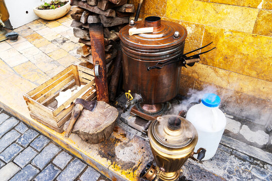 traditional antique metal samovar. Water boils in a samovar outside for brewing tea.