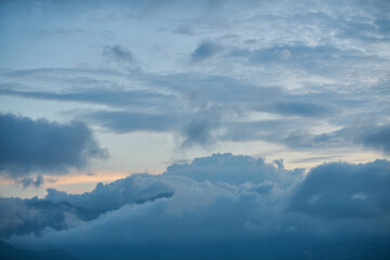 Fototapeta premium Beautiful sunset with huge close up clouds.