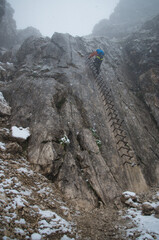 Iron ladder of the Alspitze via farrata with snow, Germany