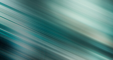 Abstrakcyjne zielone tło z dynamicznymi, ukośnymi smugami światła i delikatnym gradientem. Kompozycja tworzy wrażenie ruchu, prędkości i nowoczesnej energii. © markstudio2008