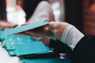 Registration desk table at conference, checking in congress forum event, visitors and attendees...