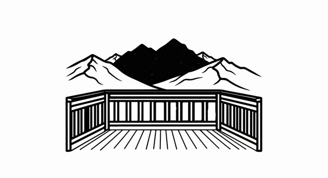 Perspective view of a wooden deck railing with mountain peaks in the background