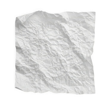 A close-up view of a crumpled white piece of paper on a flat surface